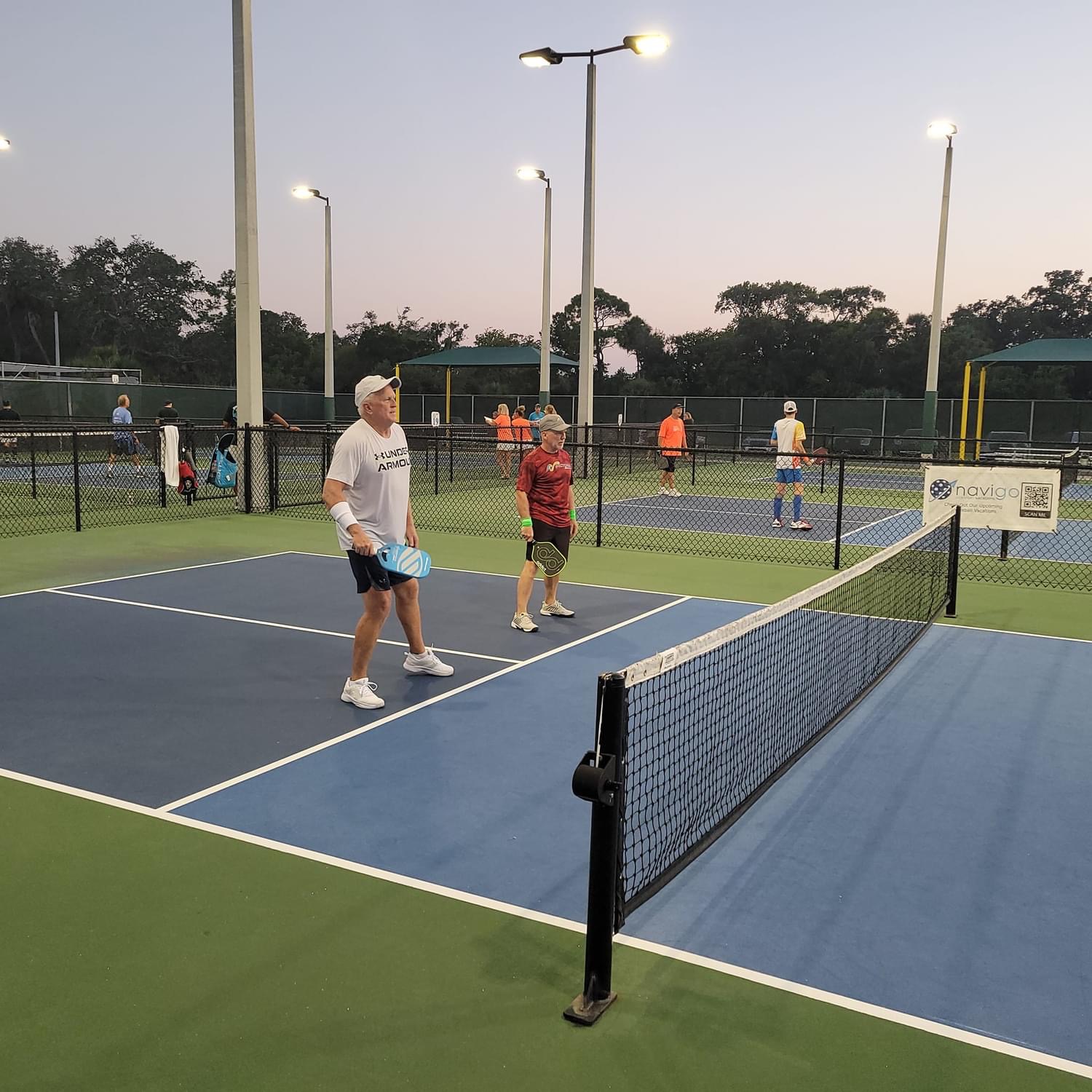 Players with sunset in background