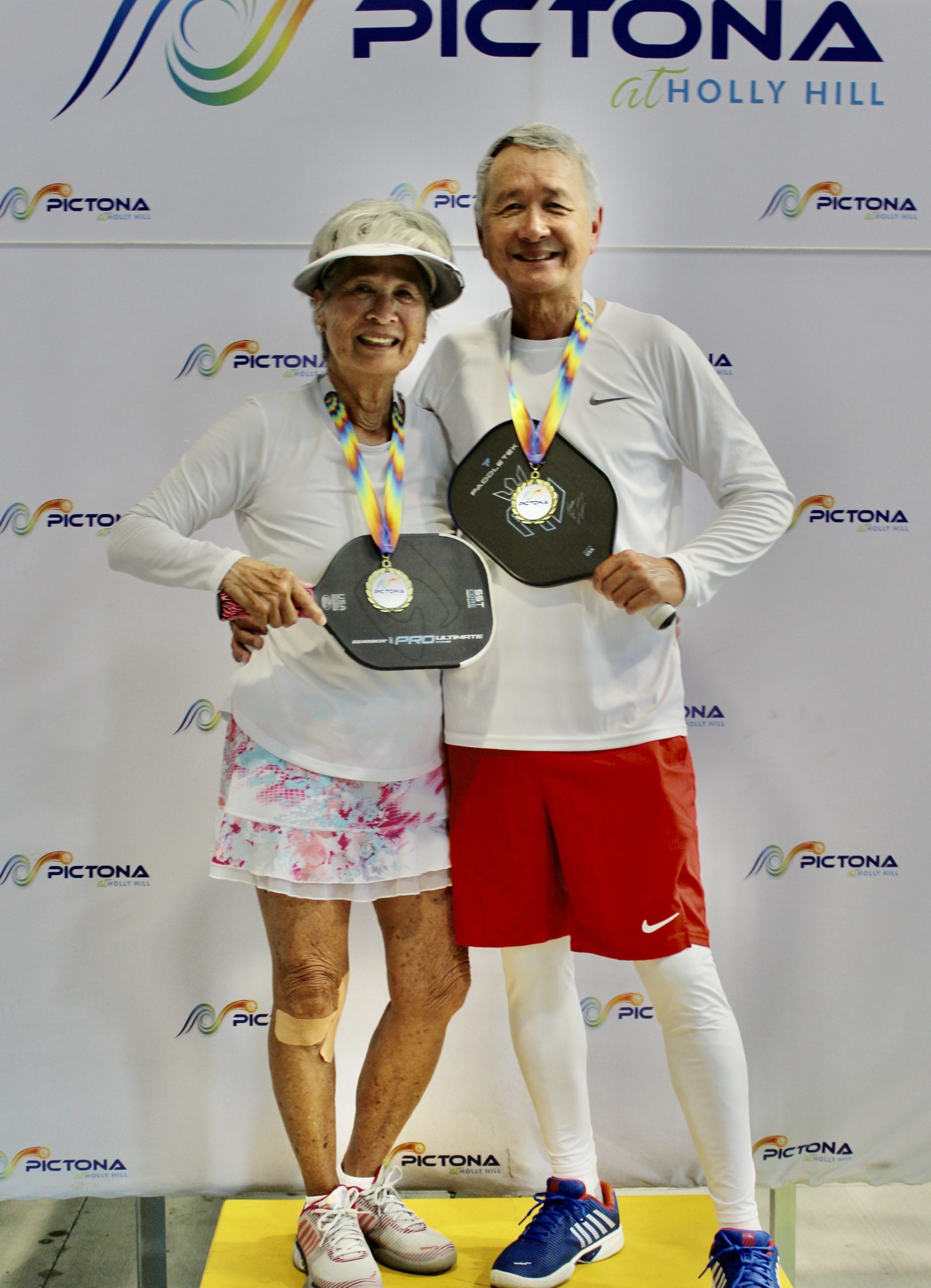 MetroHealth Super Seniors 2025 Asian couple on medal stand