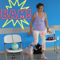 Senior Woman teaching BAM - Balance & Motion Exercise Class .