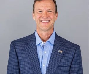 Headshot of Jeff Dillard, man in his 50's in a blue suit jacket and blue shirt