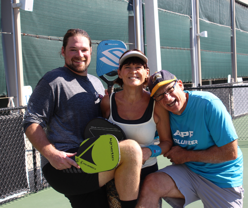 Friends playing pickleball at Pictona